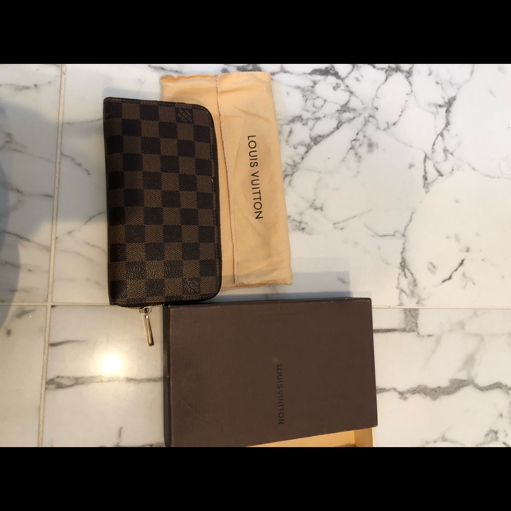 Louis Vuitton zip wallet. Worn handful of times.